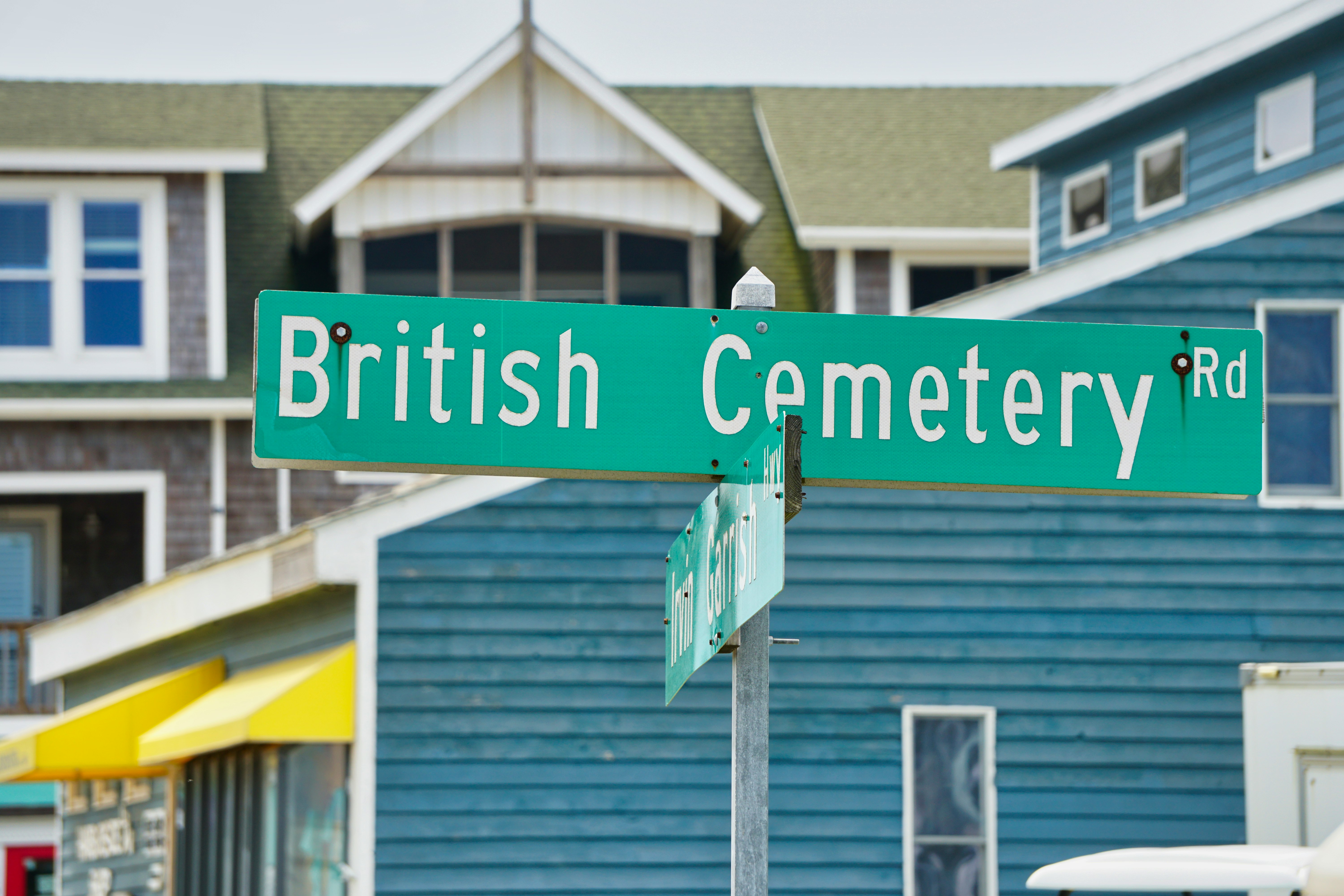 green and white wooden signage